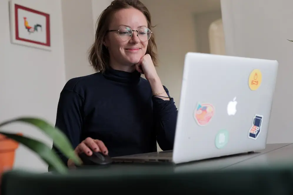 Riley working at a laptop